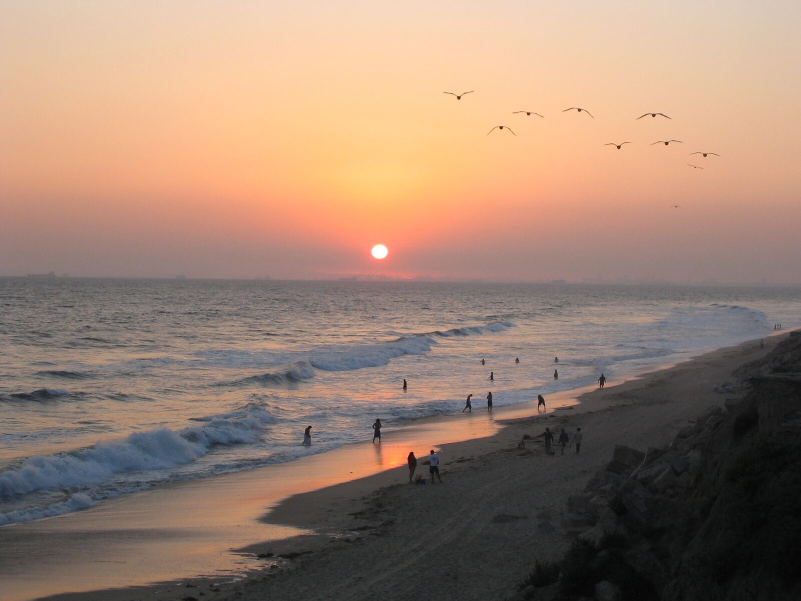 Evening light on the surf and open sand of the Huntington Beach shoreline